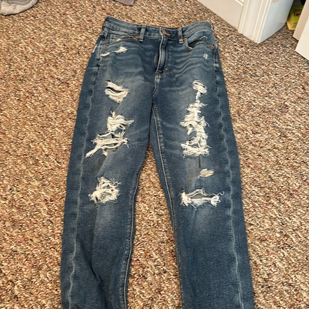 America eagle dark blue stretch mom jeans. The length is long.